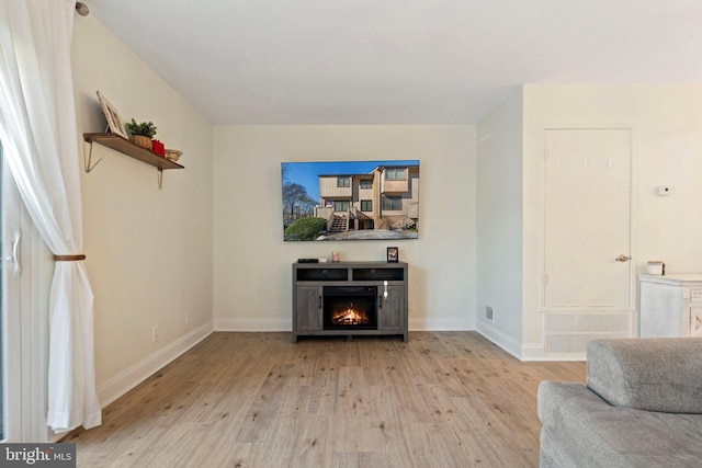 living room with light hardwood / wood-style floors