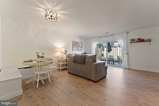 living room with light hardwood / wood-style flooring