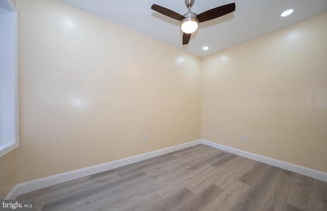 unfurnished room with ceiling fan and light wood-type flooring