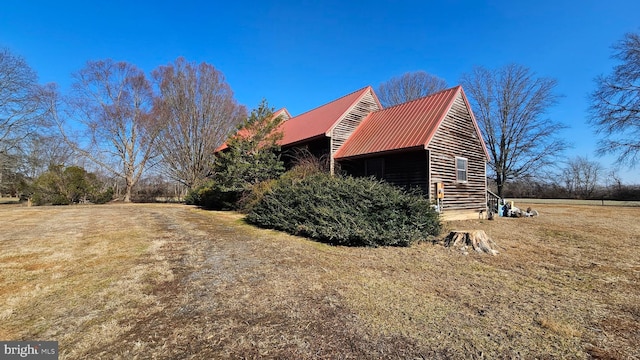 view of property exterior with metal roof