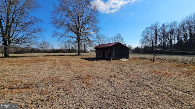 view of yard with a storage unit and an outbuilding