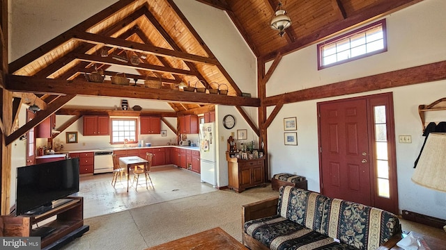 living area featuring wood ceiling, high vaulted ceiling, and beam ceiling