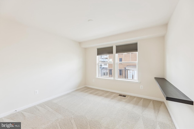 spare room featuring carpet flooring