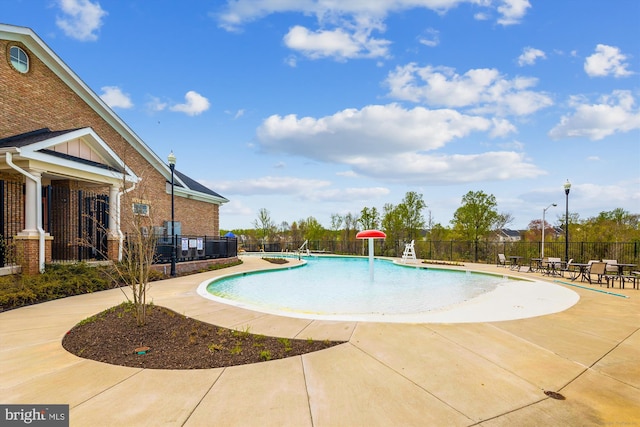 view of pool featuring a patio and pool water feature