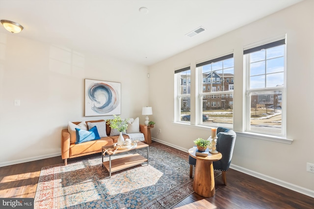 sitting room featuring dark hardwood / wood-style flooring