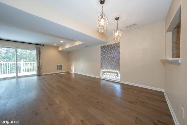 interior space featuring wood-type flooring and a chandelier