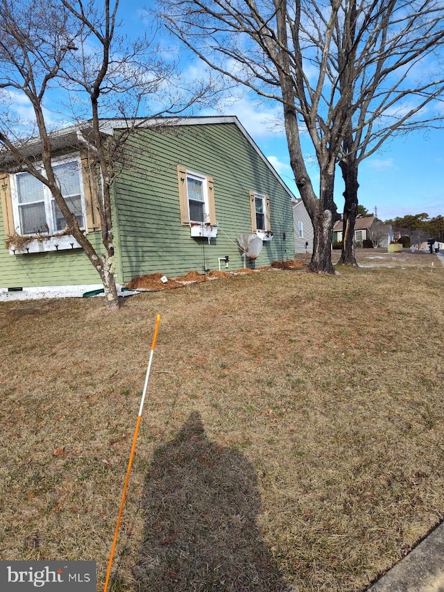 view of home's exterior featuring crawl space and a lawn