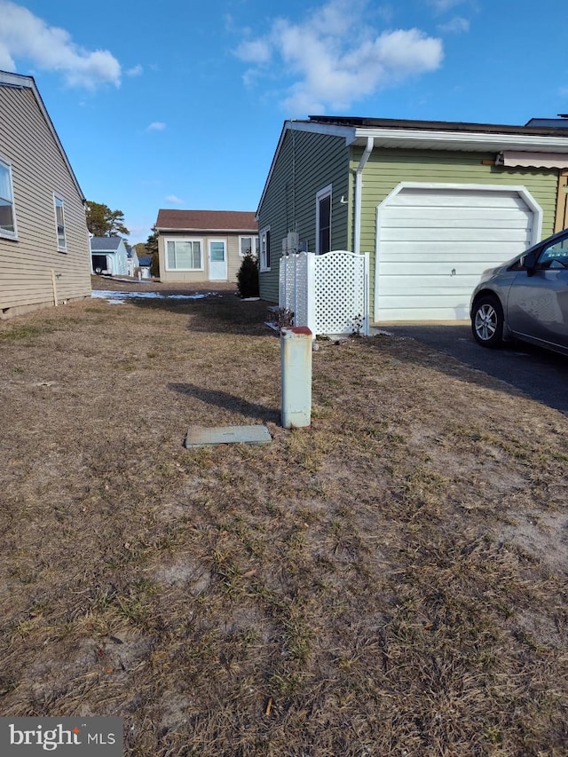 view of side of property with a garage