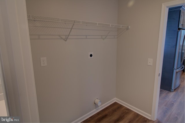 laundry area featuring hardwood / wood-style flooring and electric dryer hookup