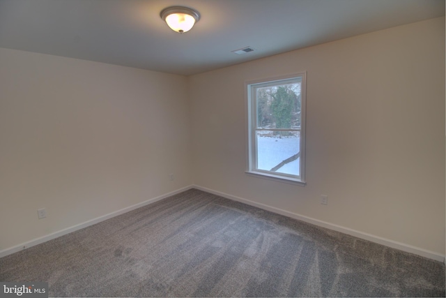 empty room with carpet flooring