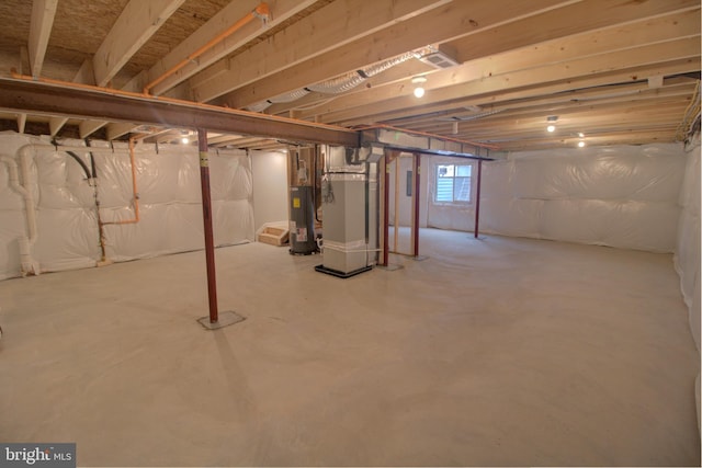 basement with heating unit and water heater