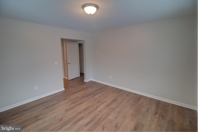 unfurnished room featuring hardwood / wood-style floors