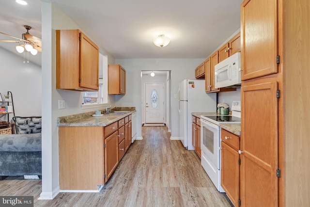 kitchen featuring ceiling fan, sink, white appliances, and light hardwood / wood-style floors