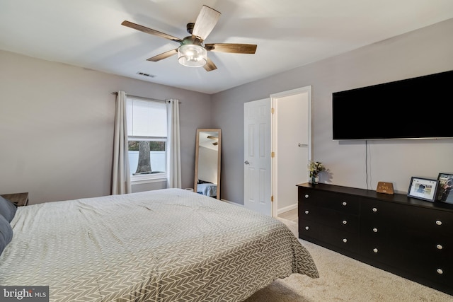 bedroom with ceiling fan and carpet flooring