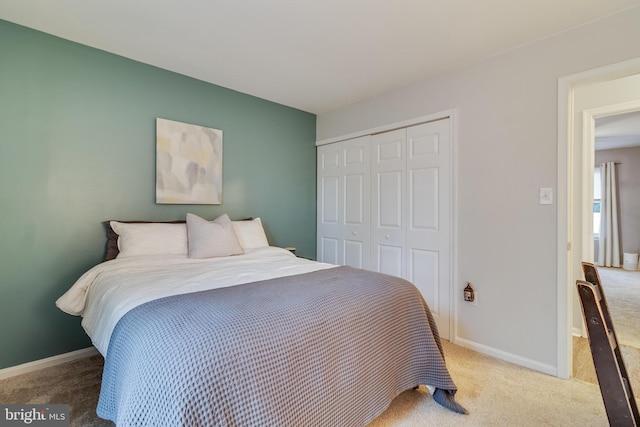 bedroom featuring carpet and a closet