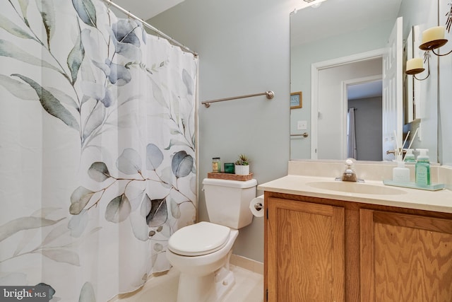 bathroom featuring vanity, a shower with curtain, and toilet