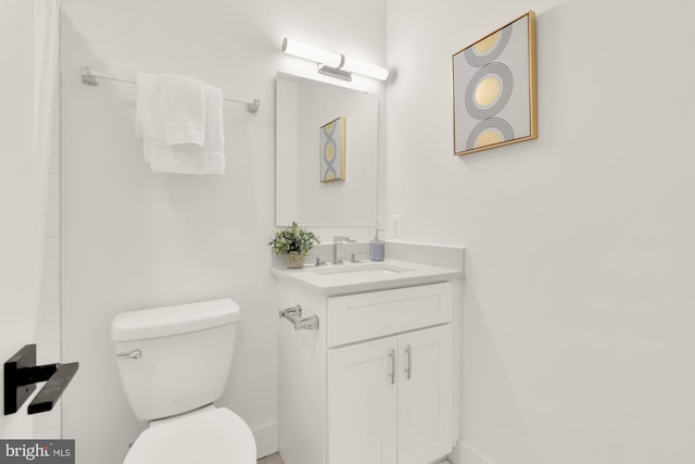 bathroom with vanity and toilet