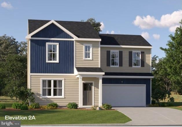 view of front of home with a garage and a front lawn