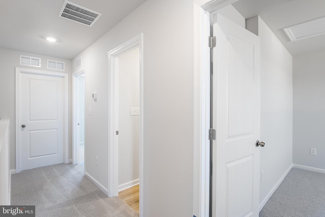 hallway with light carpet