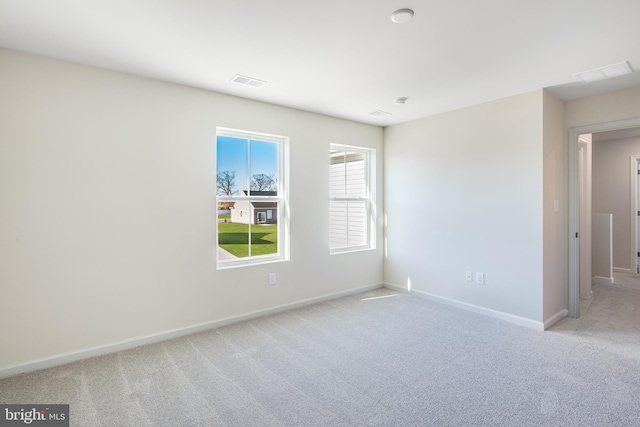 spare room with light carpet