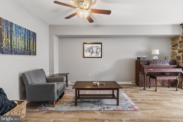 living room featuring hardwood / wood-style flooring and ceiling fan