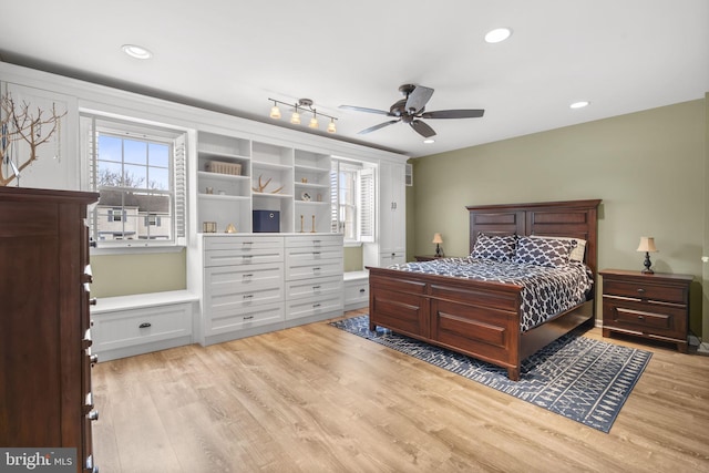 bedroom featuring light hardwood / wood-style flooring and ceiling fan