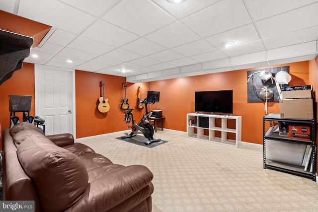 workout room featuring carpet and a drop ceiling