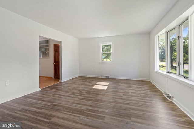 spare room featuring dark hardwood / wood-style floors