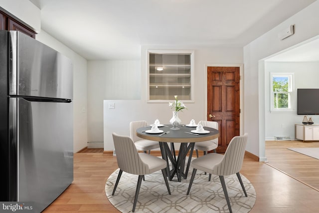 dining area with light hardwood / wood-style flooring