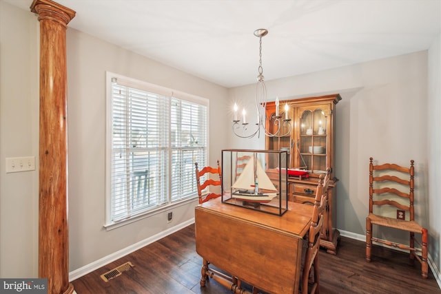 office area with dark wood-type flooring and decorative columns