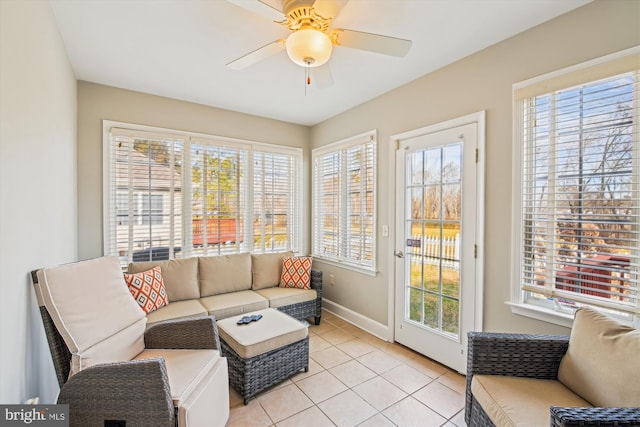 tiled living room with ceiling fan