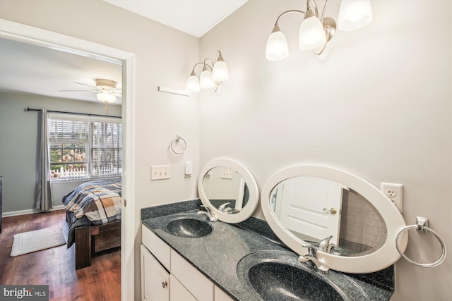 bathroom featuring ceiling fan, vanity, and hardwood / wood-style floors