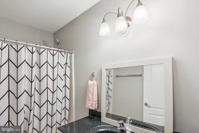 bathroom with a shower with curtain and vanity