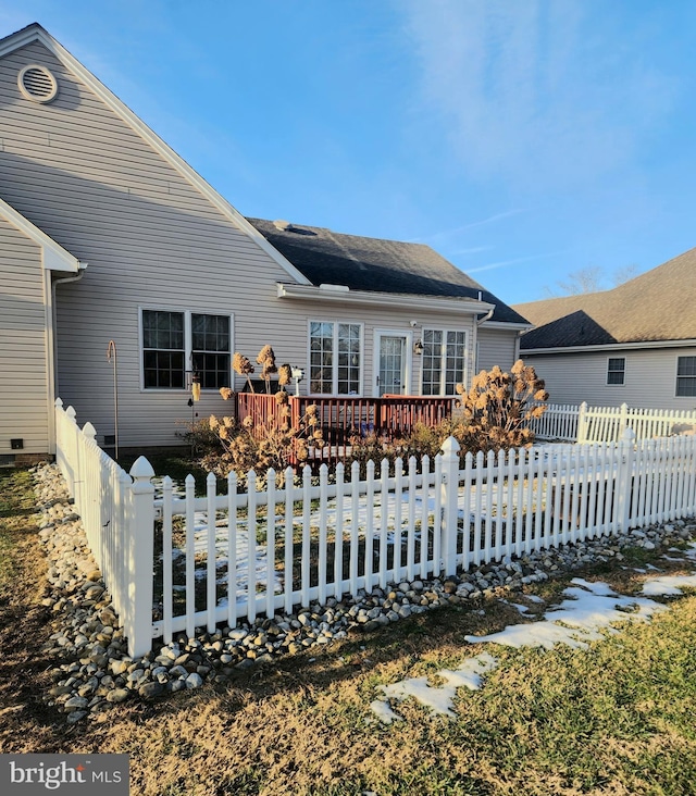 back of property with a deck