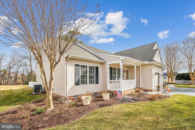 view of front of property featuring a porch, a garage, a front yard, and cooling unit