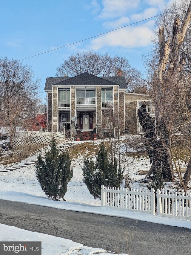 view of front of house with a balcony