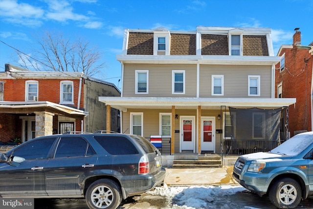 view of front of property featuring covered porch