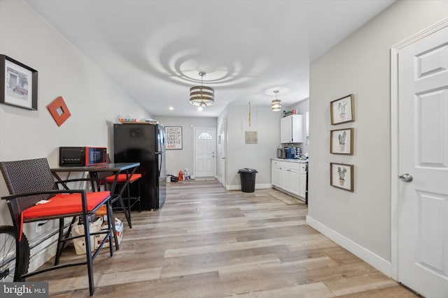 dining area with light hardwood / wood-style flooring