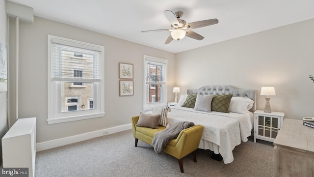 bedroom featuring ceiling fan and carpet