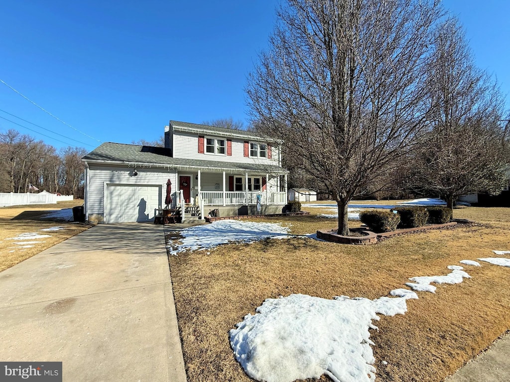 view of front of house featuring a garage and covered porch