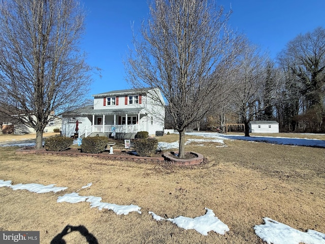 view of front of house featuring a porch and a front lawn