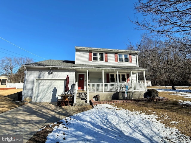 view of front of house featuring a porch and a garage