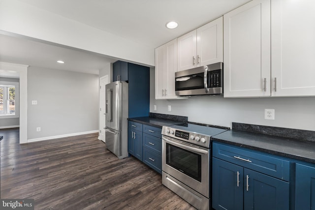 kitchen featuring dark hardwood / wood-style floors, white cabinets, stainless steel appliances, and blue cabinets