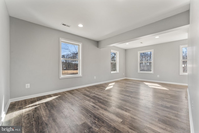 spare room featuring dark hardwood / wood-style flooring