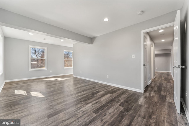 empty room featuring dark wood-type flooring