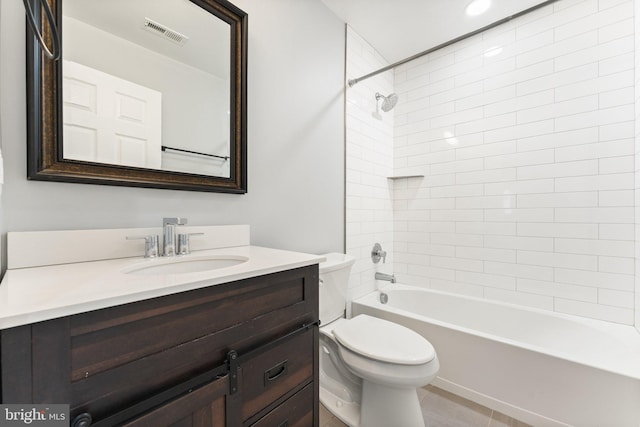 full bathroom featuring tiled shower / bath combo, toilet, and vanity