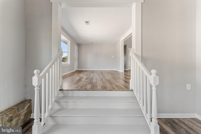 stairs with wood-type flooring