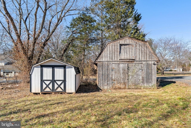 view of outbuilding with a yard