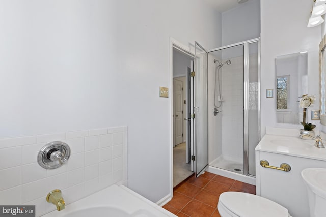 bathroom with walk in shower, tile patterned floors, toilet, and vanity