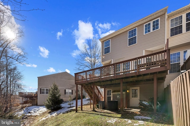 rear view of house featuring a deck